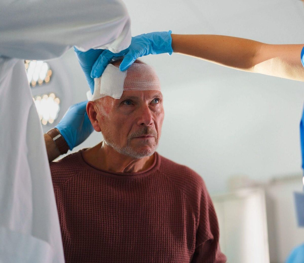 Doctors treating brain injury