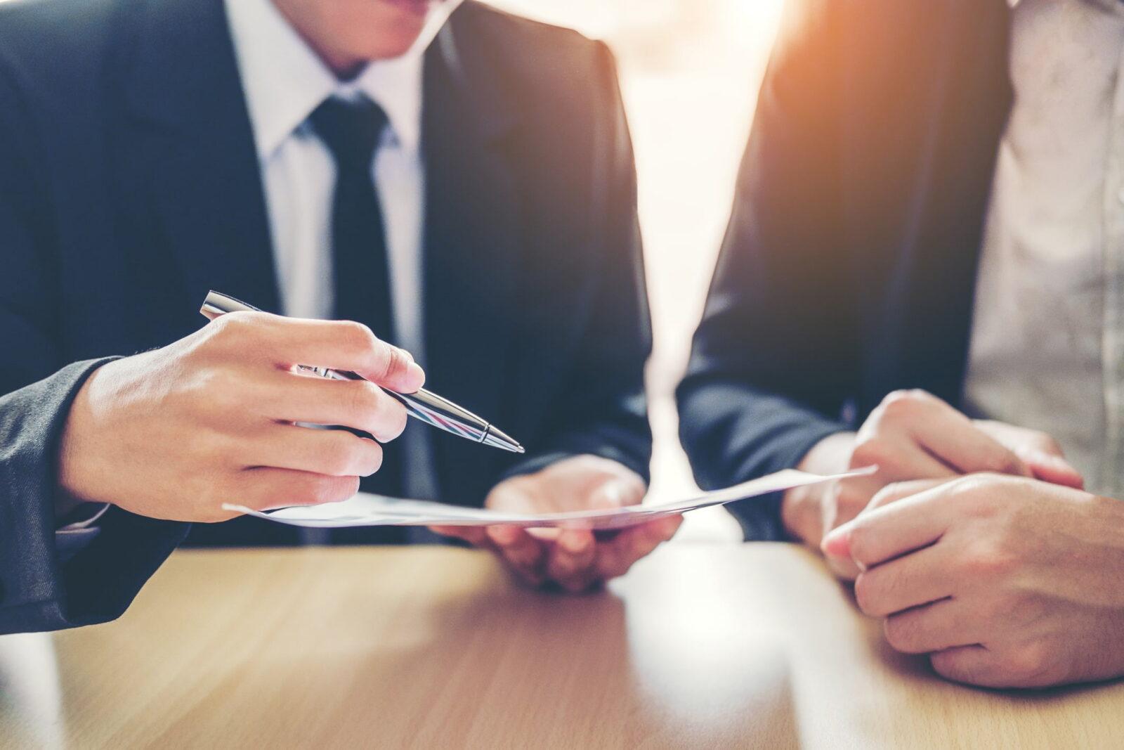 An experienced personal injury attorney helps a client file a lawsuit by gathering notes about their accident in Odessa, Texas.