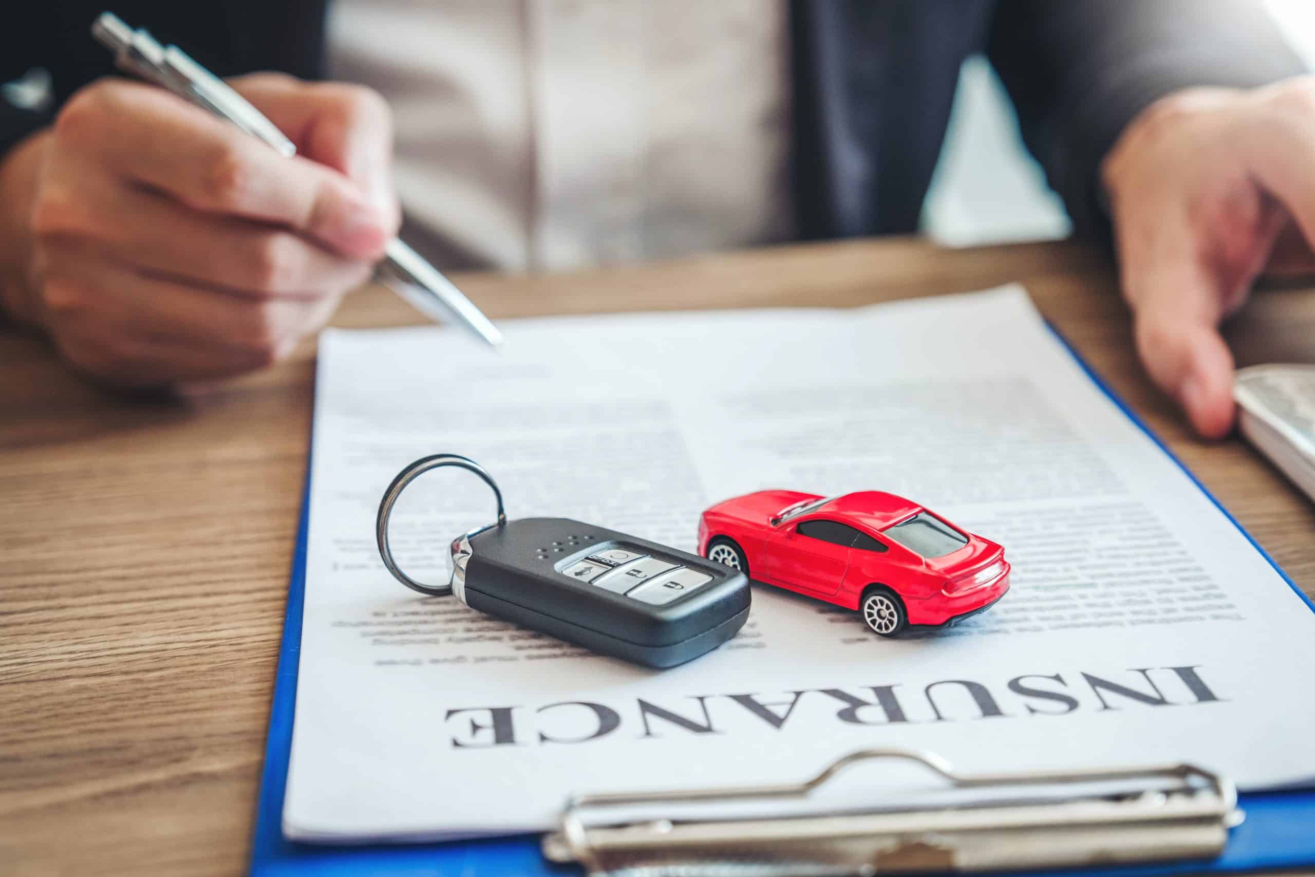 Insurance agent helping to lower car insurance rates